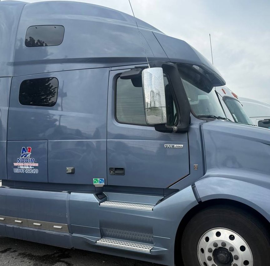 Grey tractor unit parked at the terminal