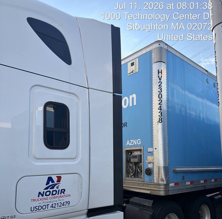 NODIR tractor unit beside a trailer